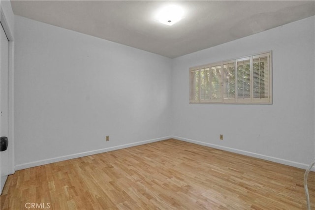 unfurnished room with light hardwood / wood-style floors