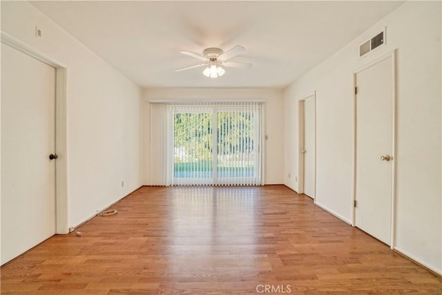 unfurnished bedroom with access to outside, light hardwood / wood-style flooring, and ceiling fan