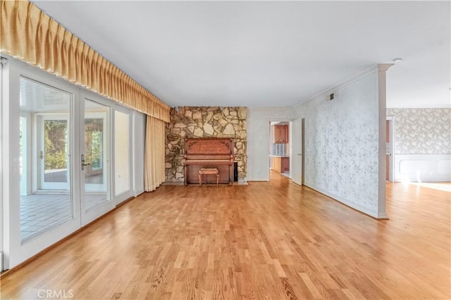 unfurnished living room with light hardwood / wood-style floors