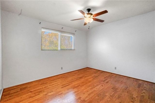 unfurnished room featuring ceiling fan and light hardwood / wood-style floors