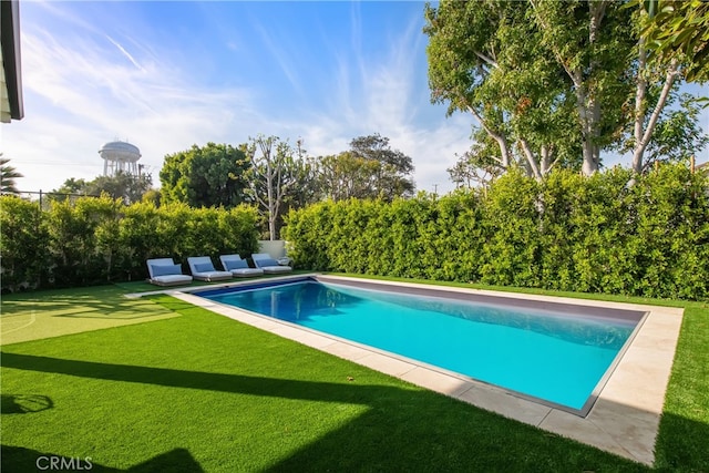 view of pool featuring a yard