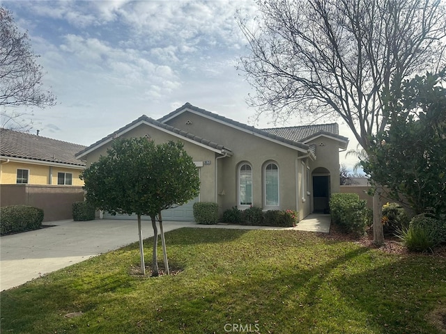 single story home featuring a front yard and a garage