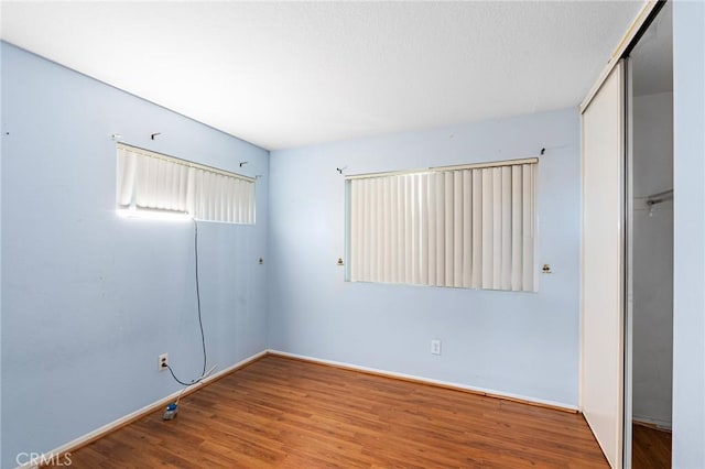 20664 Brana Rd, Riverside, CA 92508 - unfurnished bedroom featuring a closet, wood finished floors, and baseboards