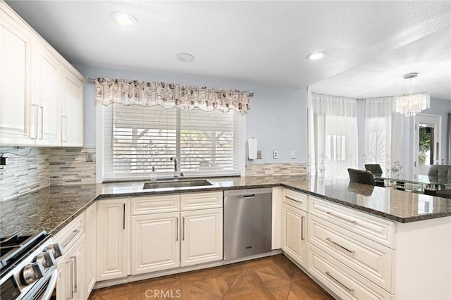 20664 Brana Rd, Riverside, CA 92508 - kitchen featuring appliances with stainless steel finishes, a sink, a chandelier, a peninsula, and recessed lighting