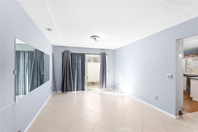 20664 Brana Rd, Riverside, CA 92508 - unfurnished room with baseboards, a smoke detector, and light tile patterned floors