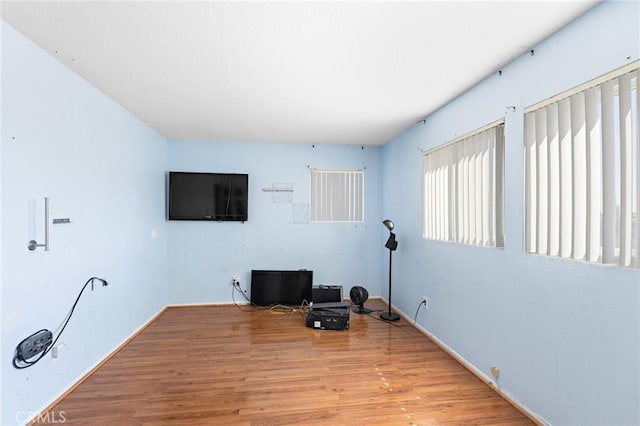 20664 Brana Rd, Riverside, CA 92508 - exercise area with wood finished floors and baseboards