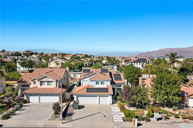 drone / aerial view featuring a mountain view