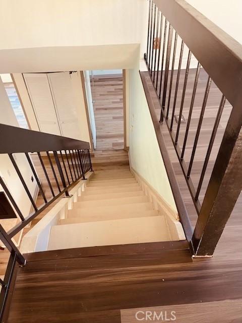 staircase featuring hardwood / wood-style flooring