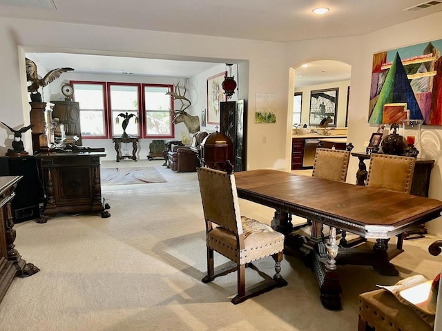 view of carpeted dining area