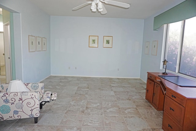 sitting room featuring ceiling fan