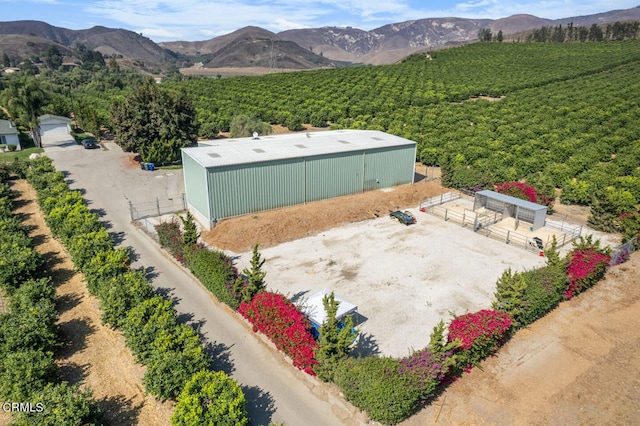 birds eye view of property with a mountain view and a rural view