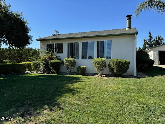 view of property exterior with a lawn