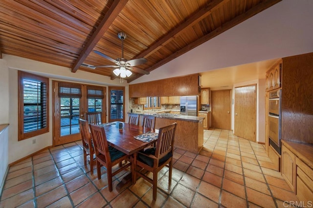 dining space with ceiling fan, beamed ceiling, french doors, high vaulted ceiling, and wooden ceiling