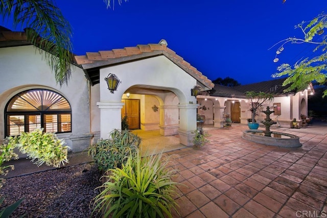 view of patio at twilight