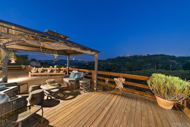 deck with an outdoor hangout area and a gazebo