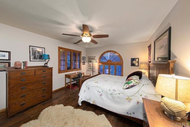 bedroom with ceiling fan and dark wood-type flooring