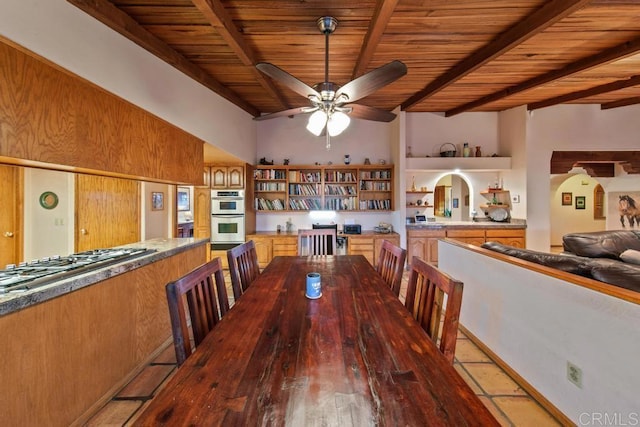 dining area with ceiling fan, beam ceiling, hardwood / wood-style floors, and wooden ceiling