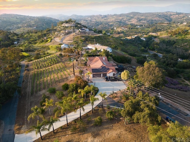 12622 Sierra Rojo, Valley Center, CA 92082 - aerial view of property and surrounding area with a mountainous background and rural landscape