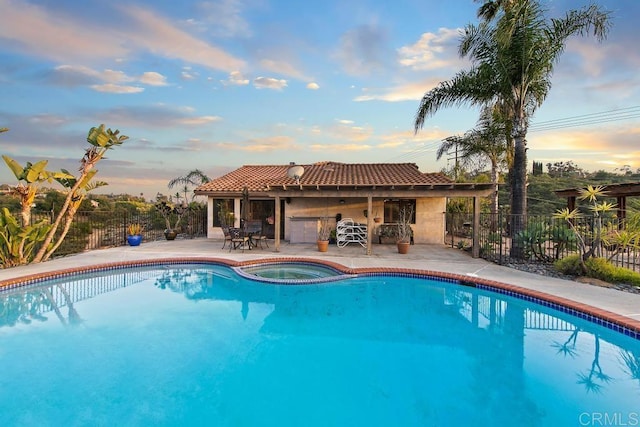 12622 Sierra Rojo, Valley Center, CA 92082 - pool at dusk with a patio area and a pool with connected hot tub