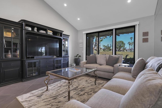 living room featuring tile patterned floors and vaulted ceiling