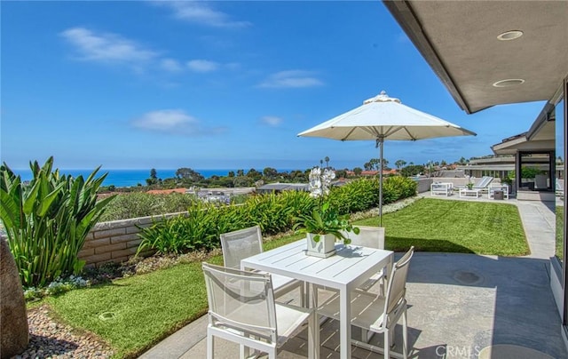 view of patio featuring a water view