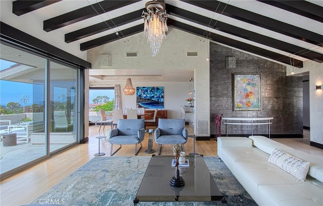 living room with high vaulted ceiling, a chandelier, hardwood / wood-style floors, and beamed ceiling