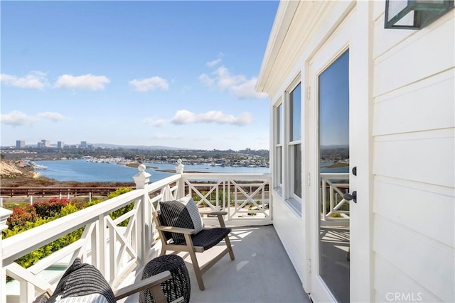 balcony featuring a water view