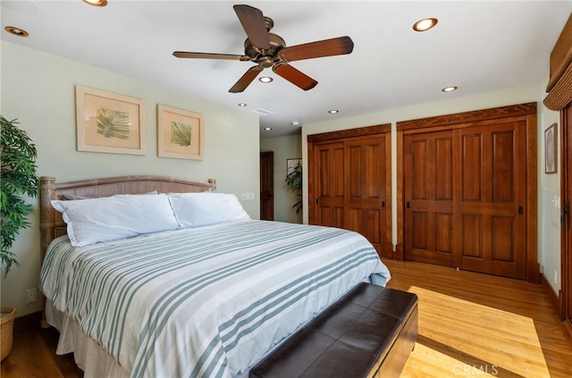 bedroom featuring ceiling fan, baseboards, wood finished floors, and recessed lighting