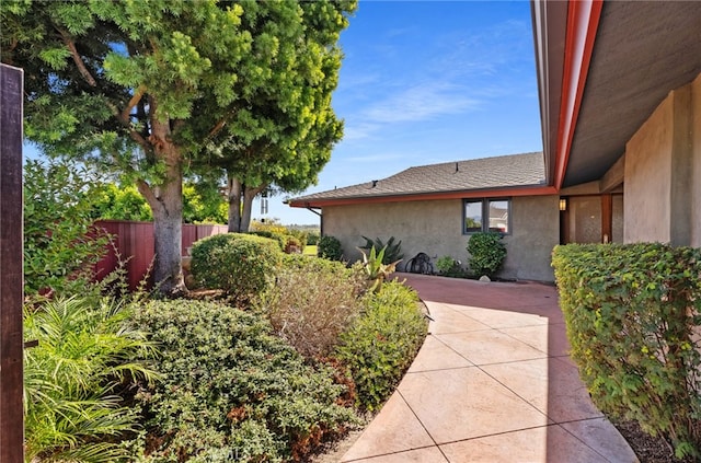 view of yard featuring a patio area and fence