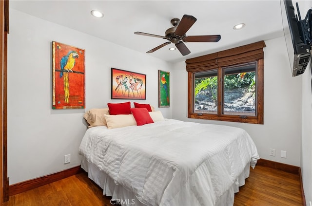 bedroom with ceiling fan, baseboards, wood finished floors, and recessed lighting