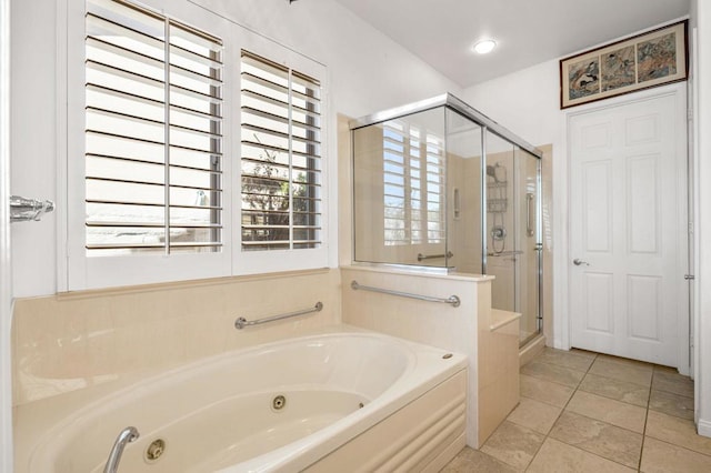 bathroom with tile patterned floors and independent shower and bath