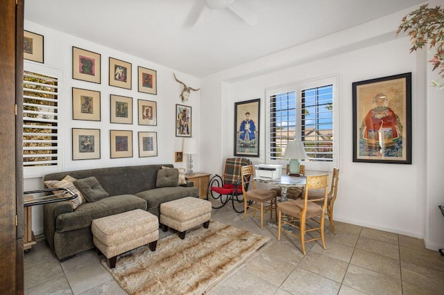 tiled living room with ceiling fan