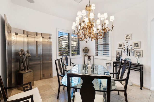 tiled dining room with a notable chandelier