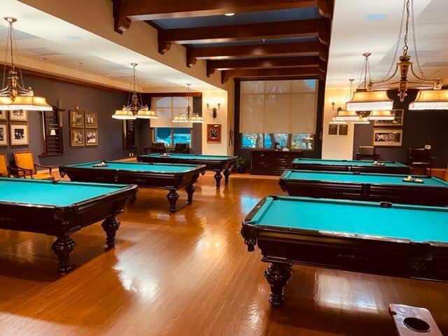 recreation room with hardwood / wood-style floors, beam ceiling, and billiards