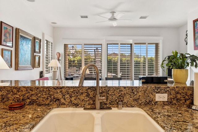 kitchen featuring ceiling fan, a healthy amount of sunlight, and sink