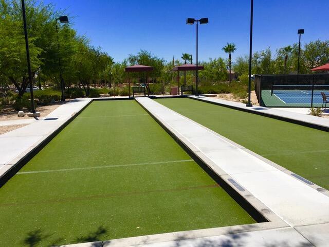 view of property's community with tennis court