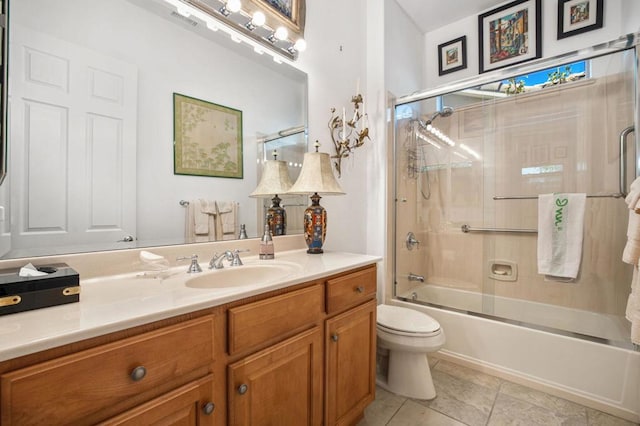 full bathroom featuring tile patterned flooring, vanity, toilet, and enclosed tub / shower combo