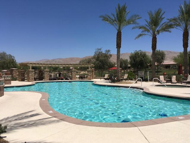 view of pool with a mountain view and a patio