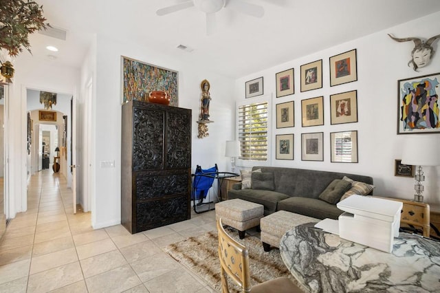 tiled living room featuring ceiling fan