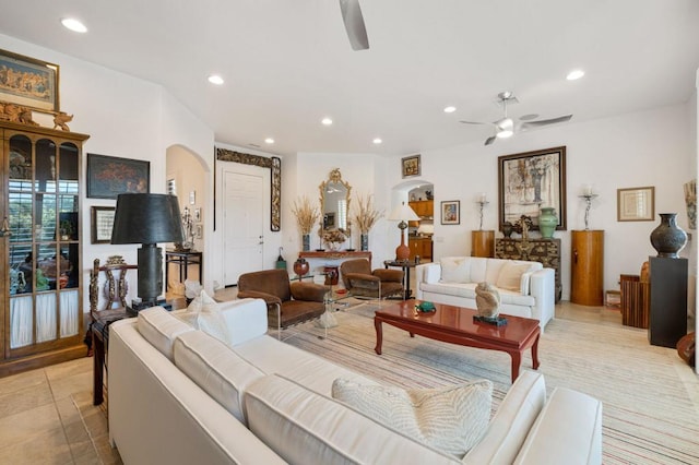 living room featuring ceiling fan and light tile patterned flooring