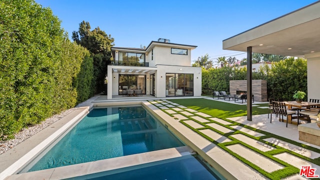 view of pool with a pergola and a patio