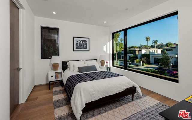 bedroom featuring wood-type flooring