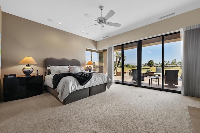 bedroom with access to exterior, ceiling fan, and carpet