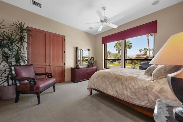 bedroom featuring ceiling fan and light colored carpet