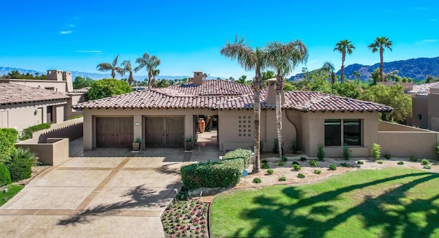 mediterranean / spanish-style house featuring a mountain view