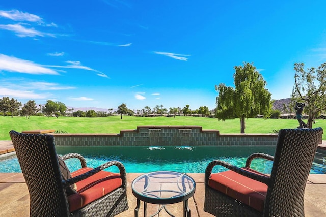 view of swimming pool with pool water feature