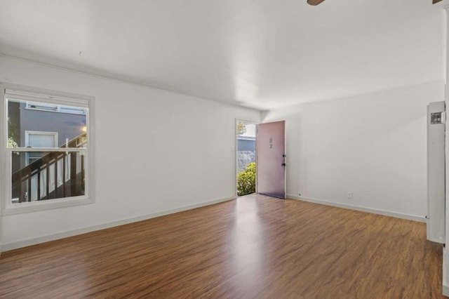 spare room with wood-type flooring