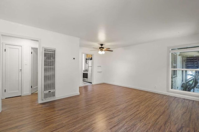 unfurnished living room featuring hardwood / wood-style floors and ceiling fan