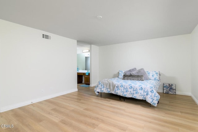 bedroom with light hardwood / wood-style floors