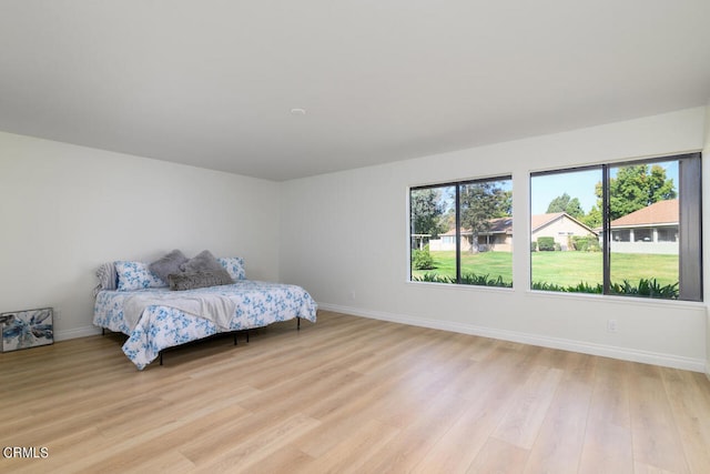 bedroom with light hardwood / wood-style flooring